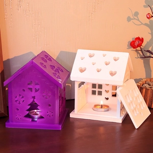 DIY Christmas house resin molds showing finished heart and snowflake tea light candle holders