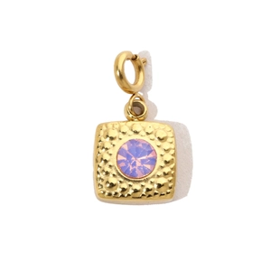 Detailed view of a gold square pendant featuring a purple zircon and hammered texture