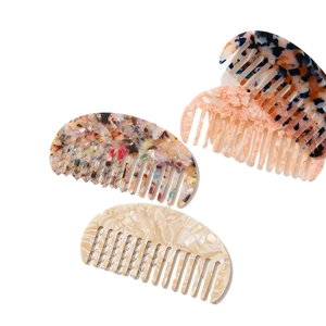 Set of four minimalist acetate hair combs with retro tortoiseshell patterns for women