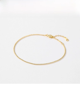 Detailed view of the gold beaded S925 silver bracelet featuring a secure lobster clasp