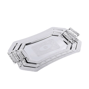 Three-piece set of silver stainless steel serving trays with ornate floral engravings