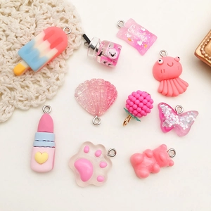 Pink resin charms including candy, lipstick and shell shapes for DIY keychain crafts