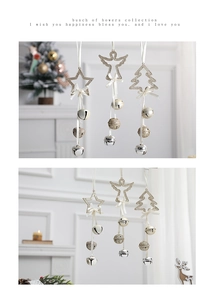 Glittery champagne gold star, angel and tree ornaments with white bows and festive bells