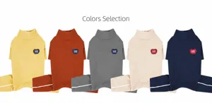 Flat lay of five high-neck dog sweaters in assorted colors with Cuddle Champ patches