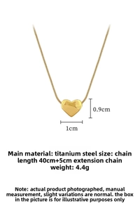 Macro detail of gold-plated heart pendant necklace in titanium steel with dimensions