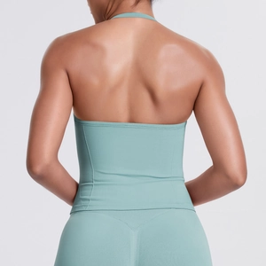 Back view of mint green high-impact halter sports bra and high-waist fitness leggings