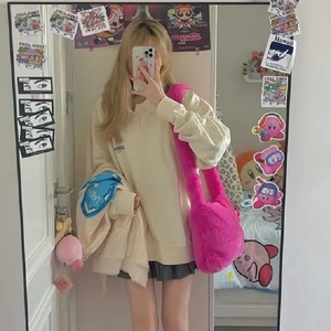 Y2K bright pink faux fur shoulder bag styled with a grey pleated skirt and polo shirt