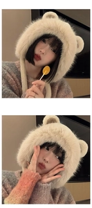 Detailed texture of beige plush bear ear hat with soft faux fur and functional earflaps