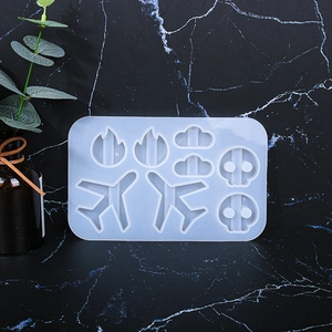Detailed translucent silicone mold with aircraft, flame, cloud, and skull shapes for DIY resin