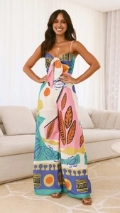 Detailed view of bohemian style jumpsuit featuring colorful abstract geometric print
