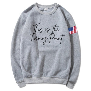Unisex heather gray hoodie with This is the Turning Point print and flag patch
