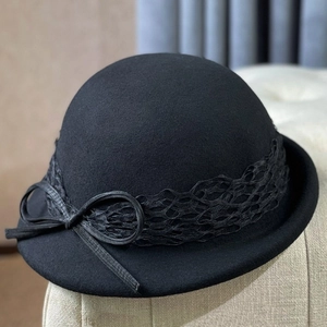 Elegant black wool felt dome hat with floral lace trim and bow for a vintage style
