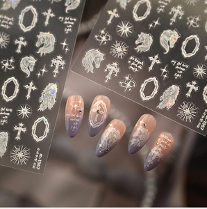 Detailed view of holographic unicorn nail stickers with star and cross patterns on nails
