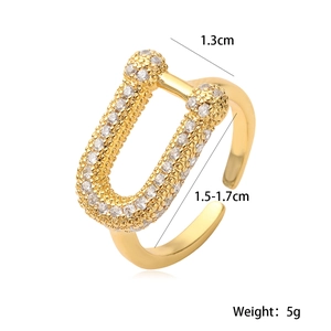 U-shaped 18K gold plated ring with zircons and geometric open design on white background