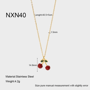 Detail showing 18K gold-plated stainless steel necklace with red enamel cherry pendant
