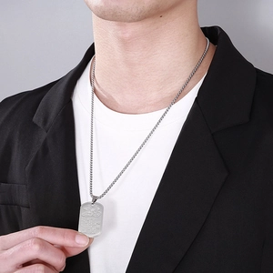 Men's titanium steel lotus pendant necklace with silver square pearl chain on a male model
