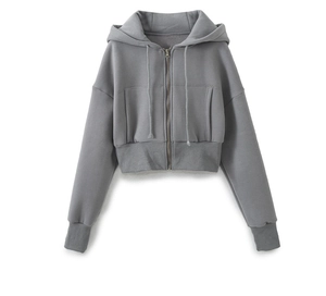 Detail of grey cropped zip-up hoodie featuring drawstring hood and ribbed cuffs