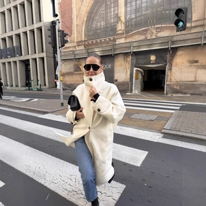 Elegant off-white oversized wool coat in longline British style for urban street fashion