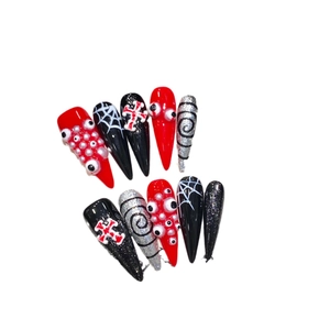 Gothic Halloween press-on nails featuring 3D eyeball designs and black spider web patterns
