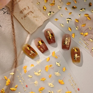 Golden ginkgo leaf nail art stickers with metallic foil finish for autumn style