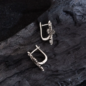 Retro hip-hop cross flower hoop earrings in silver metal with U-shaped closure