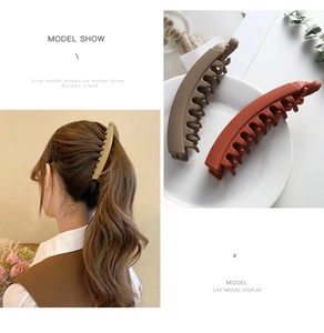 Matte banana hair clips in khaki and brick red showing secure ponytail styling