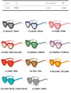 Detail of heart-shaped sunglasses with rhinestone edges in eleven gradient colors