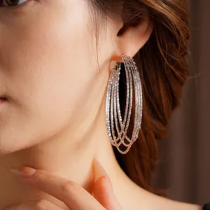 Minimalist silver multi-layer layered hoop earrings with textured shimmering finish