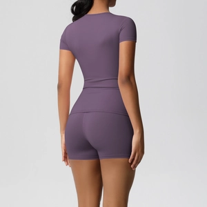 Back view of a purple slim-fit athletic set with short-sleeve top and high-stretch yoga shorts