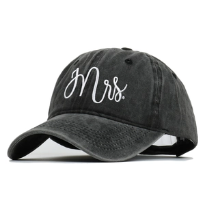 Detailed close-up of white Mrs. embroidery on vintage washed cotton baseball cap