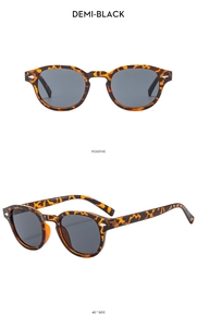 Detail view of demi-black tortoiseshell sunglasses with dark grey lenses in 45-degree angle