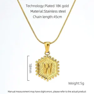 Detailed view of 18K gold plated stainless steel necklace with hexagonal letter W pendant