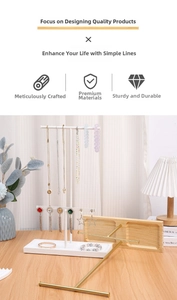 Detail of jewelry organizer set with metal T-bar stands and a wooden storage tray