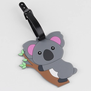 Detailed view of grey koala luggage tag made of soft silicone with black plastic strap