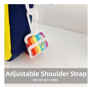 Macro shot of adjustable rainbow strap with white plastic hooks on navy canvas bag