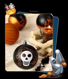 Detail of matte black Halloween ornament with glittery Day of the Dead skull pattern
