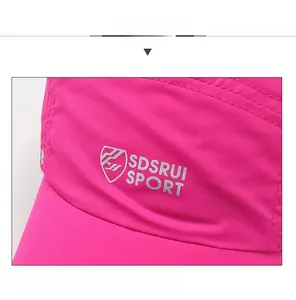 Detail view of pink baseball cap showing quick-dry fabric and SDSRUI SPORT side print