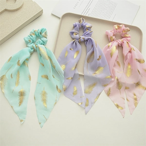 Chiffon scrunchie set with gold feather patterns in mint, lavender, and pink colors