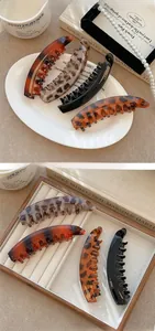Set of four French retro banana hair clips in tortoiseshell and amber patterns