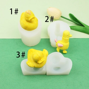 Three different 3D duck silicone molds for chocolate with yellow finished crafts