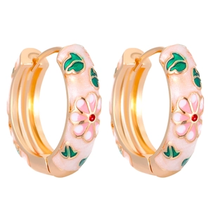 Vintage gold hoop earrings with pink enamel flowers and green leaves on white background
