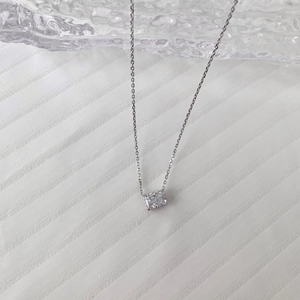 Macro detail of S925 sterling silver necklace with ice-cut square zircon pendant