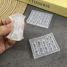 Flexible transparent silicone nail art mold showing detailed lace patterns and embossed frames