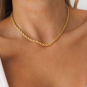 Close-up of 18k gold plated stainless steel rope chain necklace on a model's collarbone