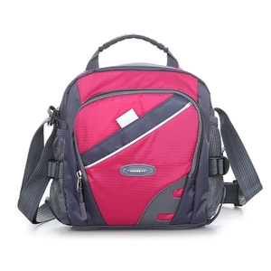Detail of waterproof nylon crossbody bag featuring top handle and adjustable grey strap