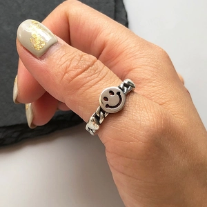 925 sterling silver smiley face ring with cuban chain band worn on thumb for women