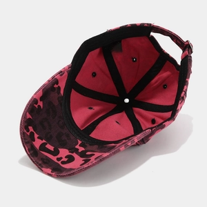 Detailed interior view of a pink leopard print baseball cap with adjustable strap and free size label