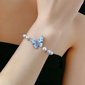 Bracelet élégant perle et papillon avec zircon bleu et placage d'argent pour femme