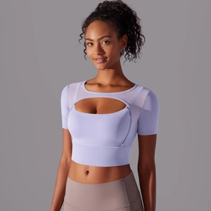 Close-up of lavender mesh patchwork crop top with cutout detail for yoga and fitness