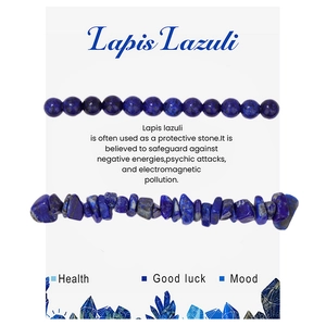 Macro detail of polished lapis lazuli round beads and irregular crushed natural stones